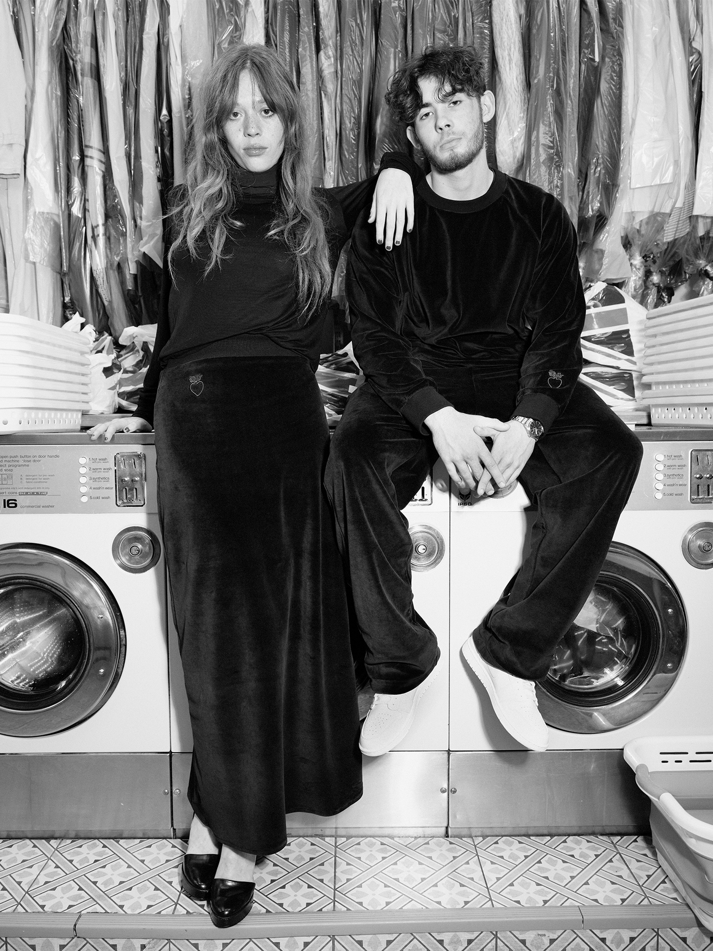 2 people in laundrette sitting on waching machines, woman wearing Heavy Velour A-line Skirt in midnight blue