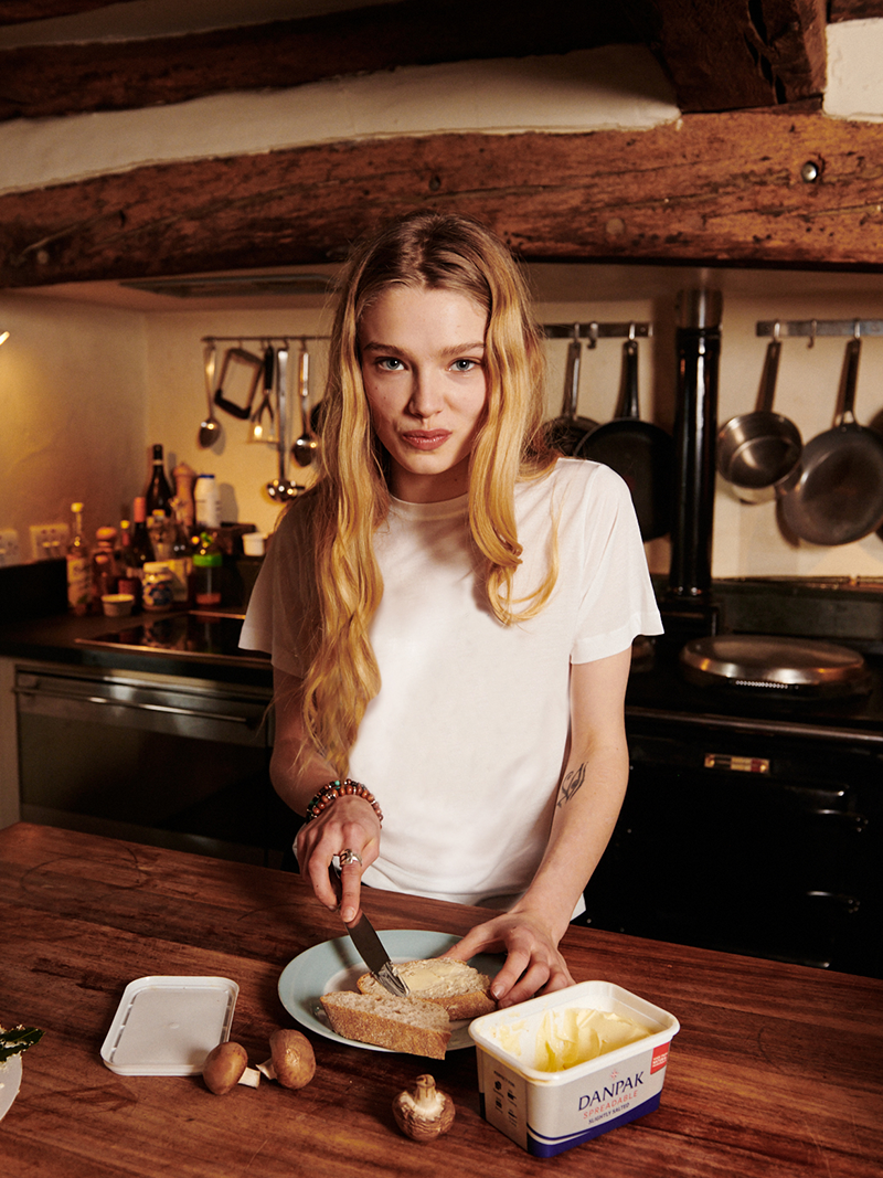 woman buttering bread while modelling Lightweight T-Shirt in white