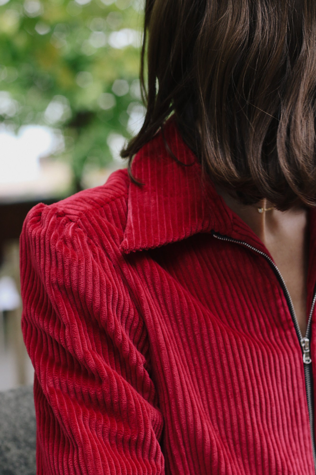 Woman wearing the red cord Winston Jumpsuit close up of collar