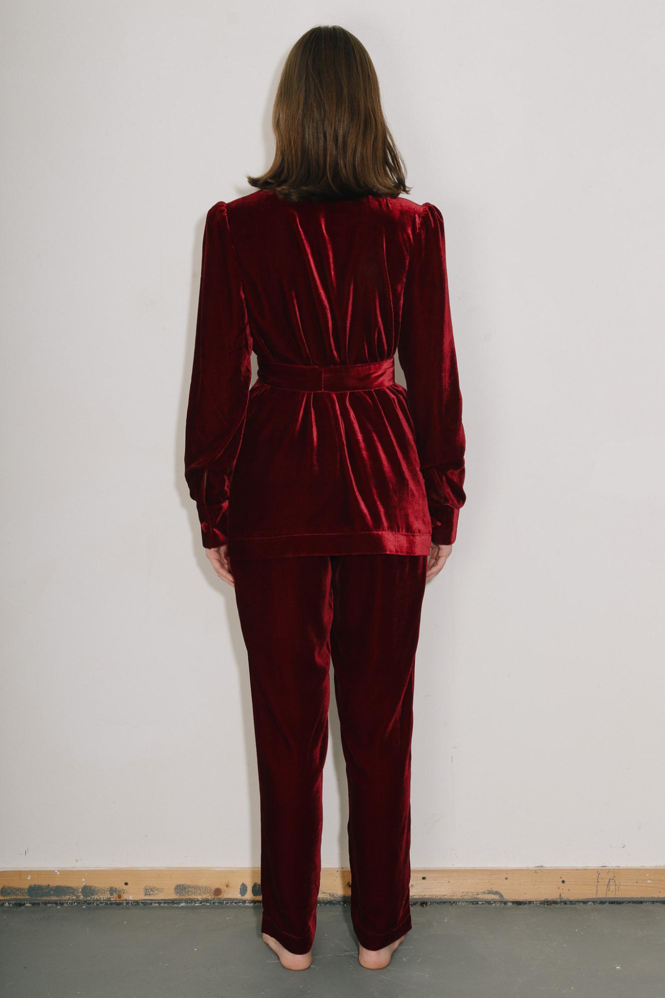 woman wearing the velvet Gentlewomen Trousers and Jacket in red. back view