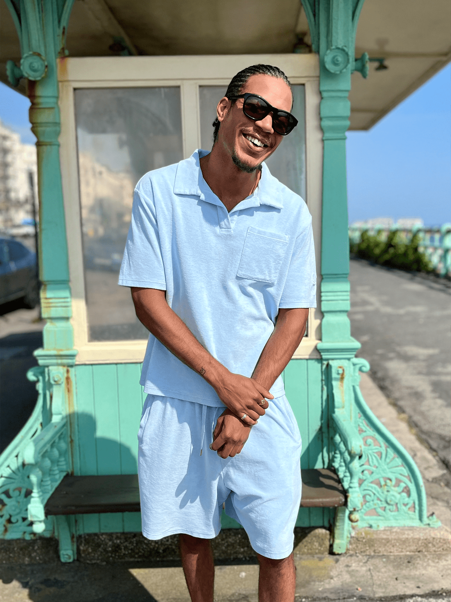 man wearing Organic Terry Polo in sky blue and sunglasses