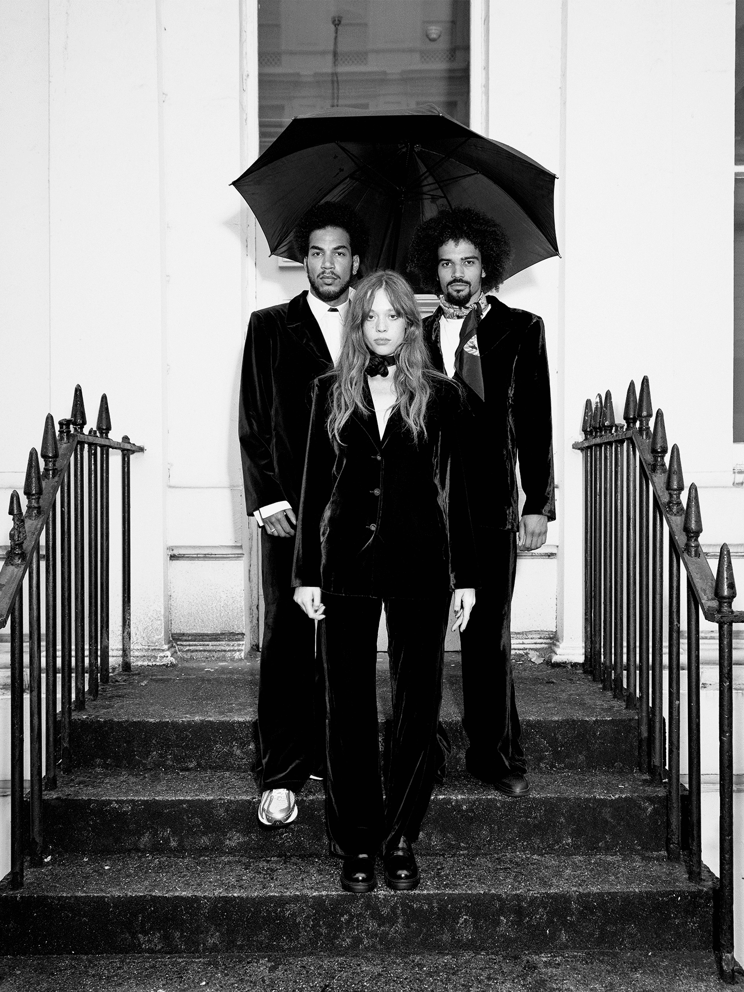 woman and two men modelling cotton Velvet All-Day Suit stood on steps