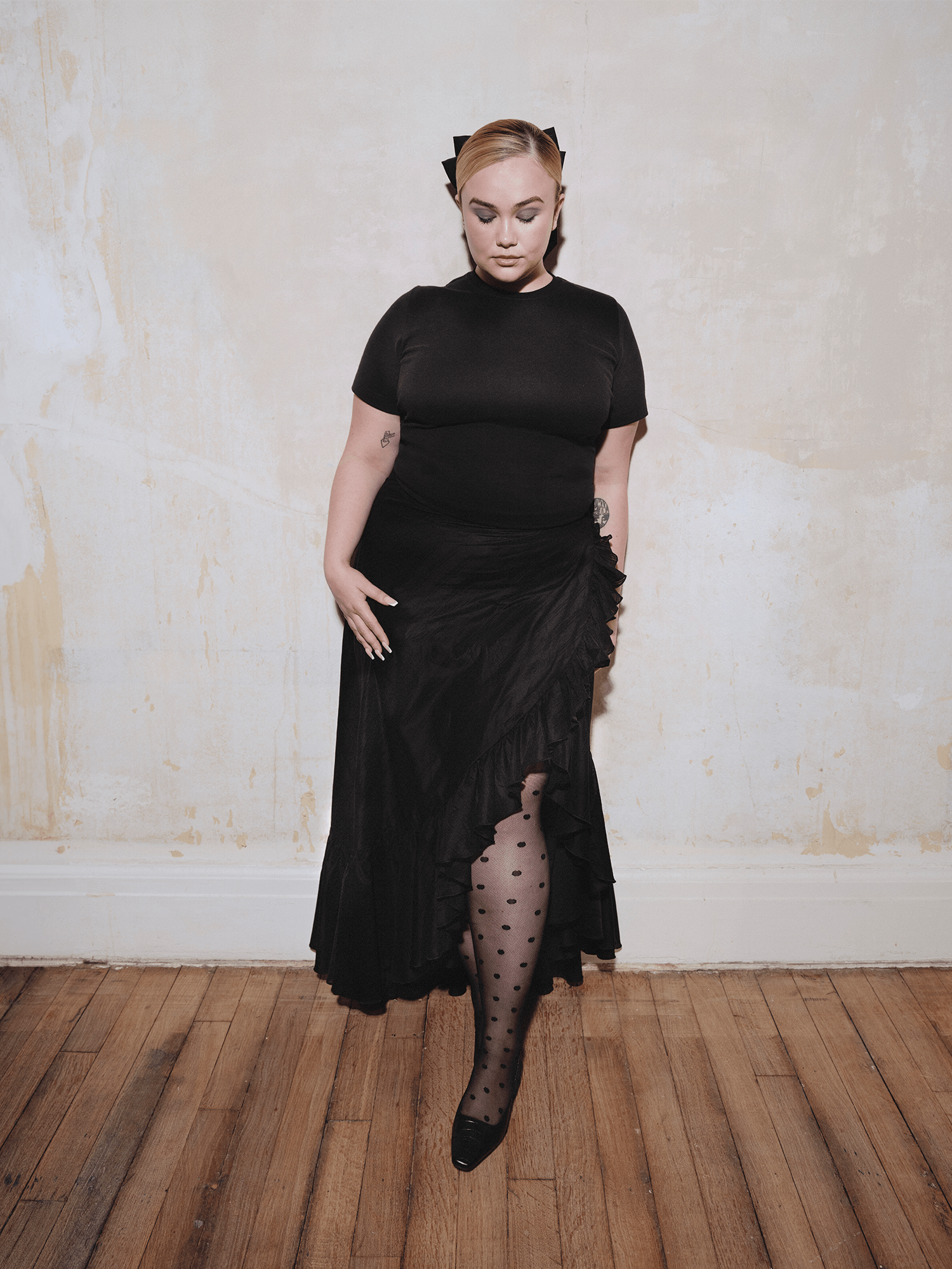 model wearing The Wrap Skirt in black
