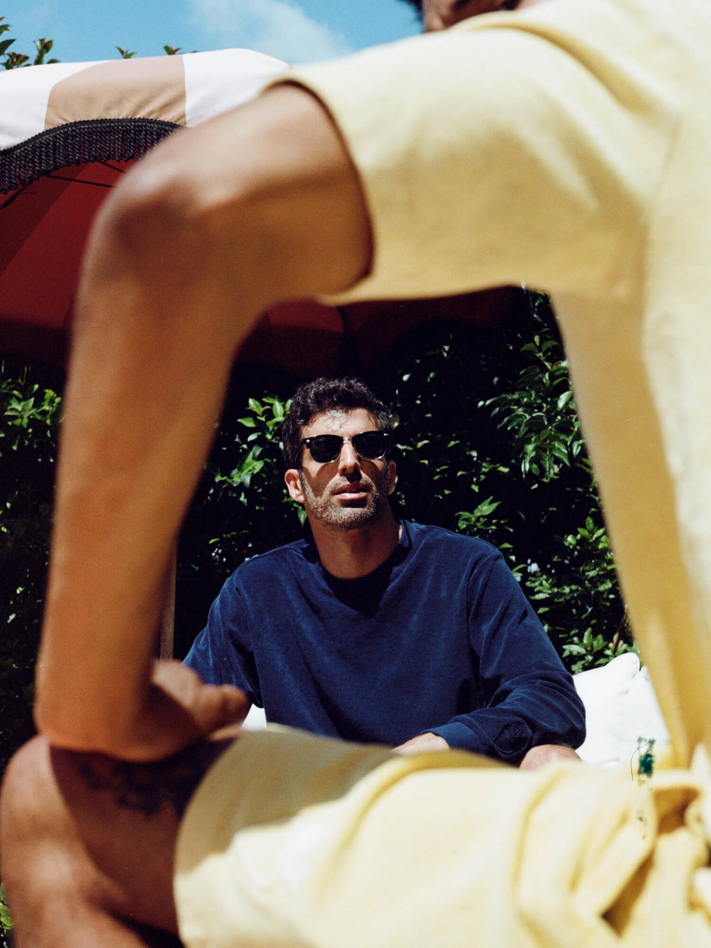 through arm shot of man wearing Organic Terry Polo in golden sand