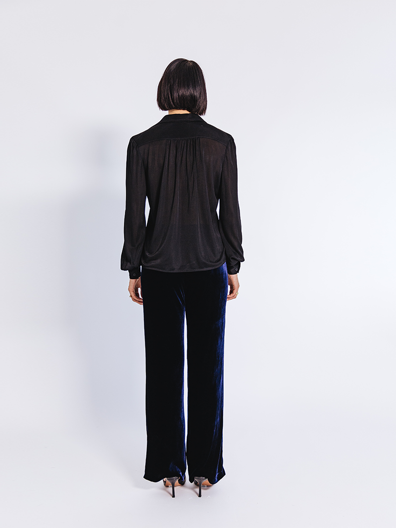 woman modelling Slinky Pique Shirt in black, back view