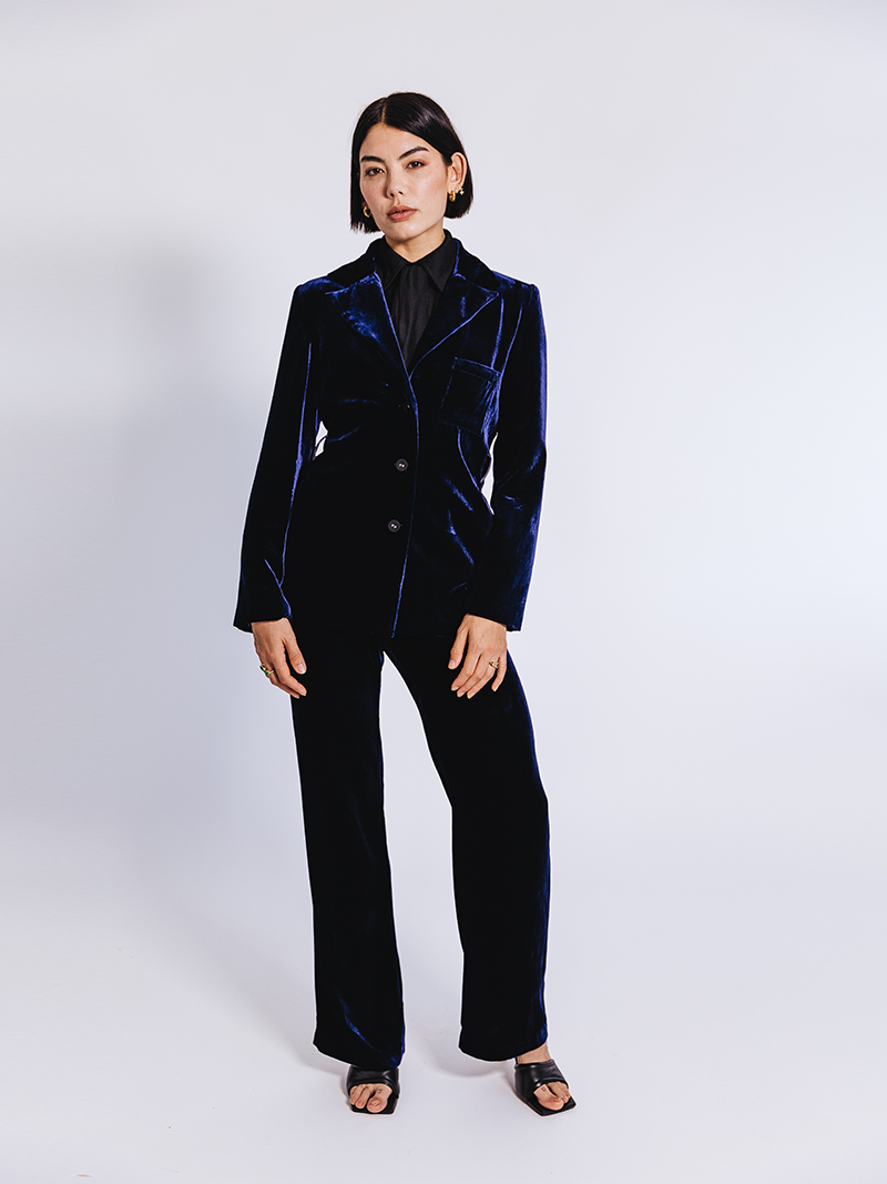 woman modelling Slinky Pique Shirt in black with velvet suit