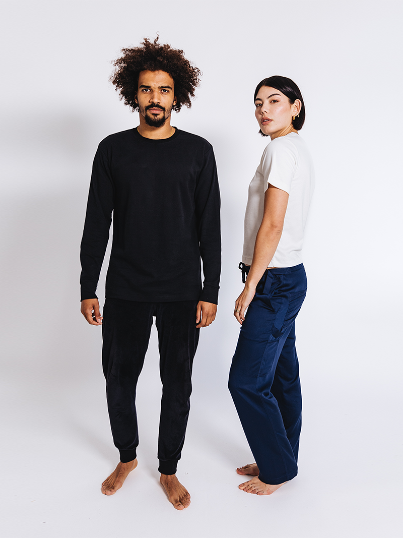 man and woman modelling Organic Velour Tracksuit Bottoms in black