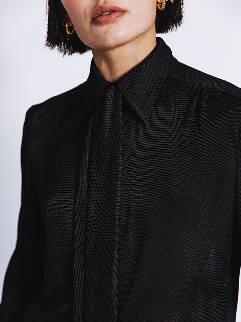 close up of woman modelling Slinky Pique Shirt in black