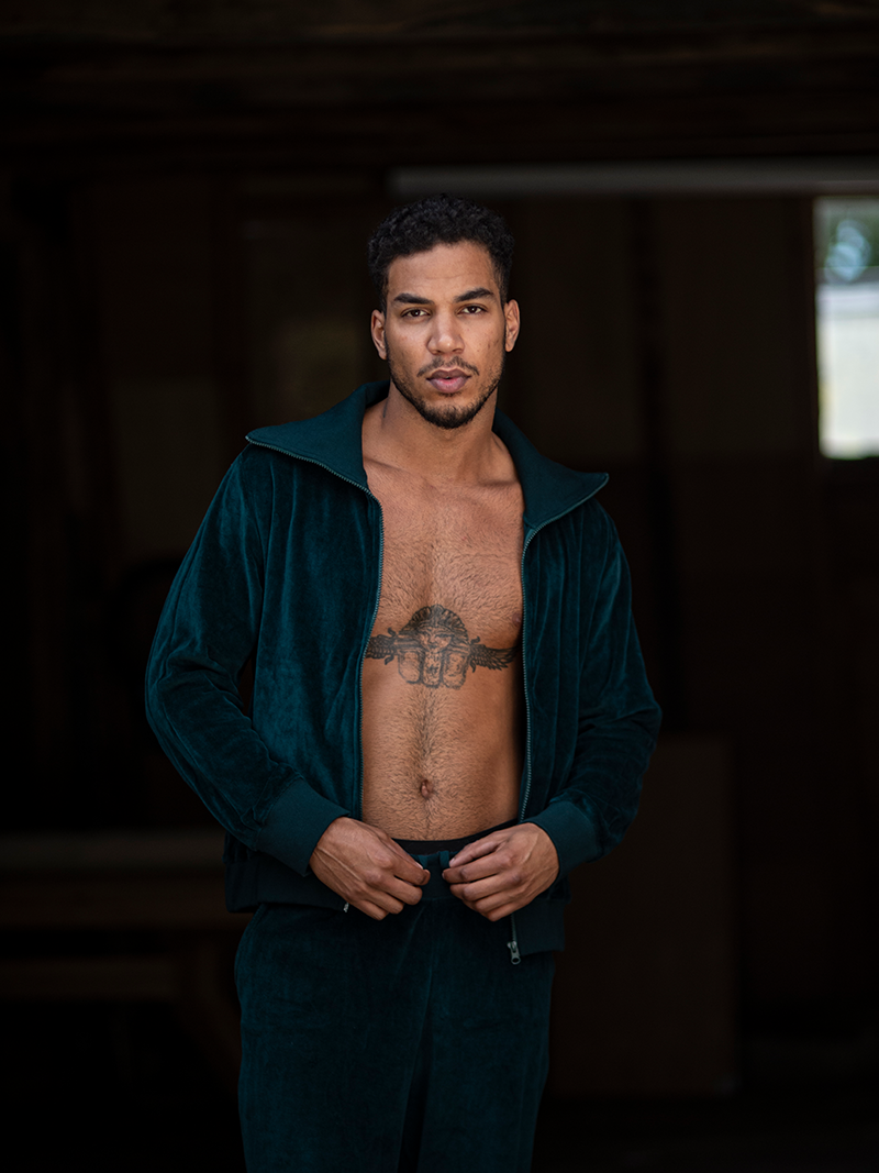 man modelling Organic Velour Zip Jumper in green