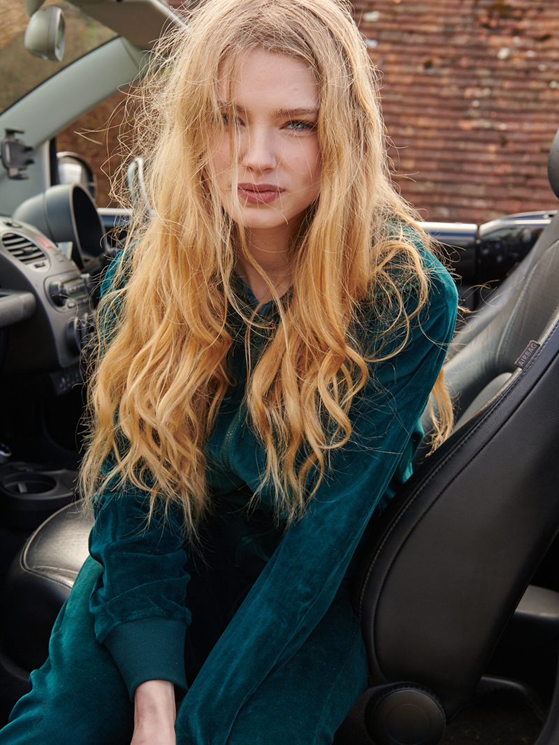 woman modelling Organic Velour Zip Jumper in green