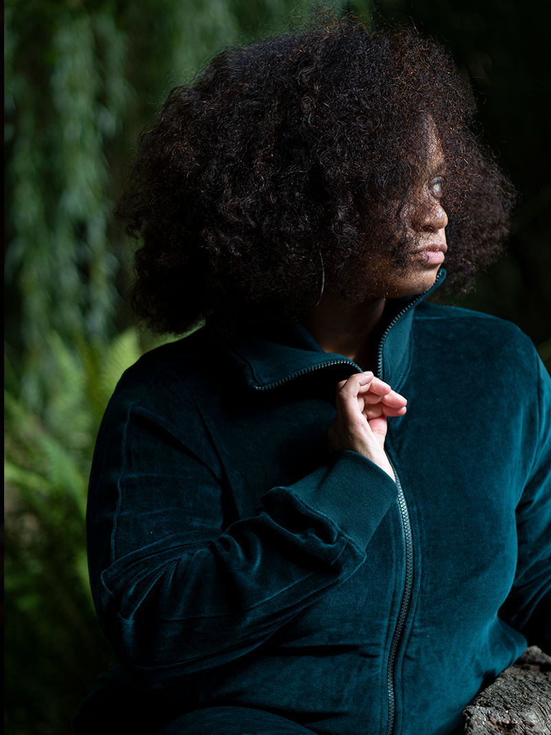 woman modelling Organic Velour Zip Jumper, looking away